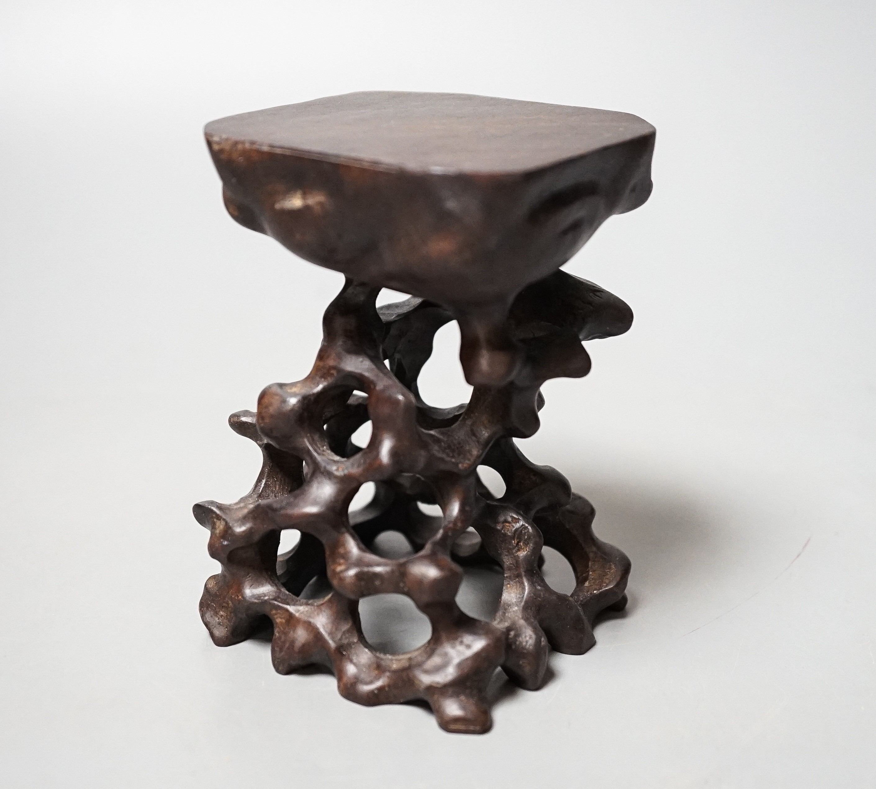A Chinese carved hardwood stand 10.5cm